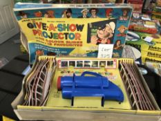 A Chad Valley Give-A-Show projector,
