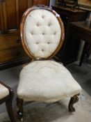 A Victorian walnut cabriole leg chair.