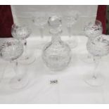 A crystal decanter and 6 wine goblets.