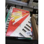 A good selection of guitar and keyboard books and some sheet music.