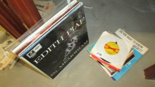 A good lot of LP and 45 rpm records and sheet music from the 1960's and 1970's.