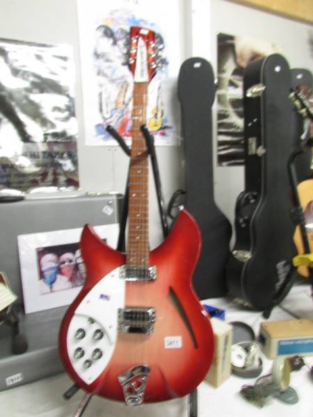 A 2004 left hand model 330/12 Made in USA Rickenbacker 12 string guitar with hard case.