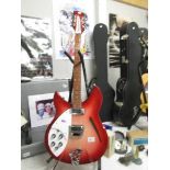 A 2004 left hand model 330/12 Made in USA Rickenbacker 12 string guitar with hard case.