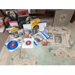 A huge collection of mainly John Lennon books, CD's and original newspapers.