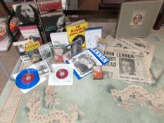 A huge collection of mainly John Lennon books, CD's and original newspapers.