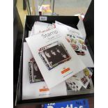 A box of assorted Beatles stamps etc.