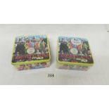 Two 300 piece double sided Beatles jigsaw puzzles in tins,