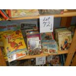 A shelf of books and annuals including Secret Seven, Yogi Bear, Railway and car books.
