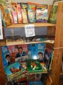 Five shelves of interesting annuals including Superman, The Saint, Fireball XL5, Dakatari,