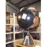 A Legend black globe on a chrome plated stand.