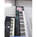 A Yamaha PSA22 keyboard and a Casio MT240 keyboard.