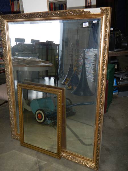 A large gilt framed mirror and one other.