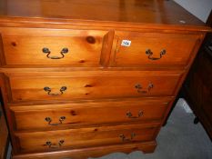 A satin walnut 2 over 3 chest of drawers.