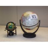 An Insight world globe and a globe pencil sharpener.