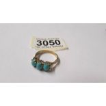 A 9ct gold ring set turquoise coloured stones, size S. Total weight 3.4 grams.