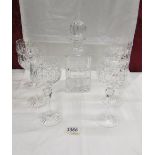 A crystal decanter and 6 wine goblets.