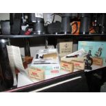 4 boxed and one unboxed microscopes with extra specimen slides.