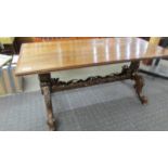 A good and solid oak coffee table on carved base.