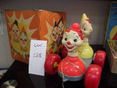A 1960's pull along Coco & Chico clowns