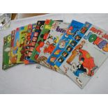 An assortment of children's comics including Mickey Mouse,