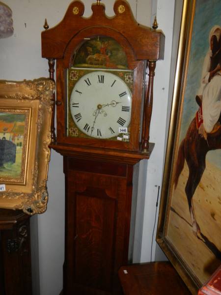 An oak round face Grandfather clock.