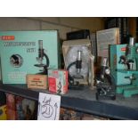 3 boxed collectable microscopes and 2 unboxed.