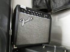 A Fender Frontman 15g practice amp.