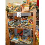 Three shelves of interesting books and magazines including Lion annuals, Thunderbirds etc.