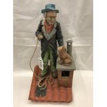 A bisque figure of a chimney sweep.