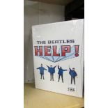 A Beatles Help boon and Help laser disc film.