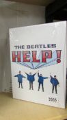 A Beatles Help boon and Help laser disc film.