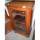 An Edwardian inlaid music cabinet.