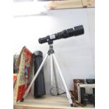 A telescope on tripod.