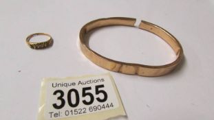 A 9ct gold bangle a/f and a 9ct gold ring (missing some stones)
