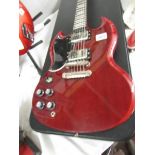 An Epiphone SG left hand pro guitar with hard case.