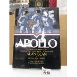 An autographed copy of "Apollo" book illustrated with astronaut Alan Bean's (4th man on the moon)