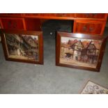 A pair of oak framed coaching pictures.