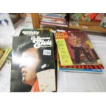 A quantity of Elvis books including scrap book 1935-1977.