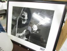 A framed and glazed John Lennon photograph.