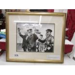 A framed and glazed Ahlomov photo of Titov with Krushchev and Gagarin, signed in his native Russian.