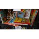 A shelf of assorted annuals including TV 21, Whizzer, TV Comic, Topper etc.