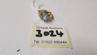 A 9ct gold ring set pale blue stone (stone is scratched), size N, total 3.1 grams.
