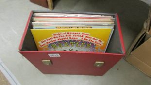 A record case with 15 Beatles albums.