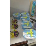 5 Utterly Butterly butter dishes and 3 Utterley Butterly kitchen timers.
