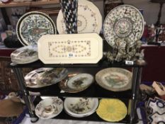 3 shelves of collectors plates