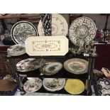 3 shelves of collectors plates