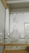 A cut glass claret jug and a set of 6 glasses.