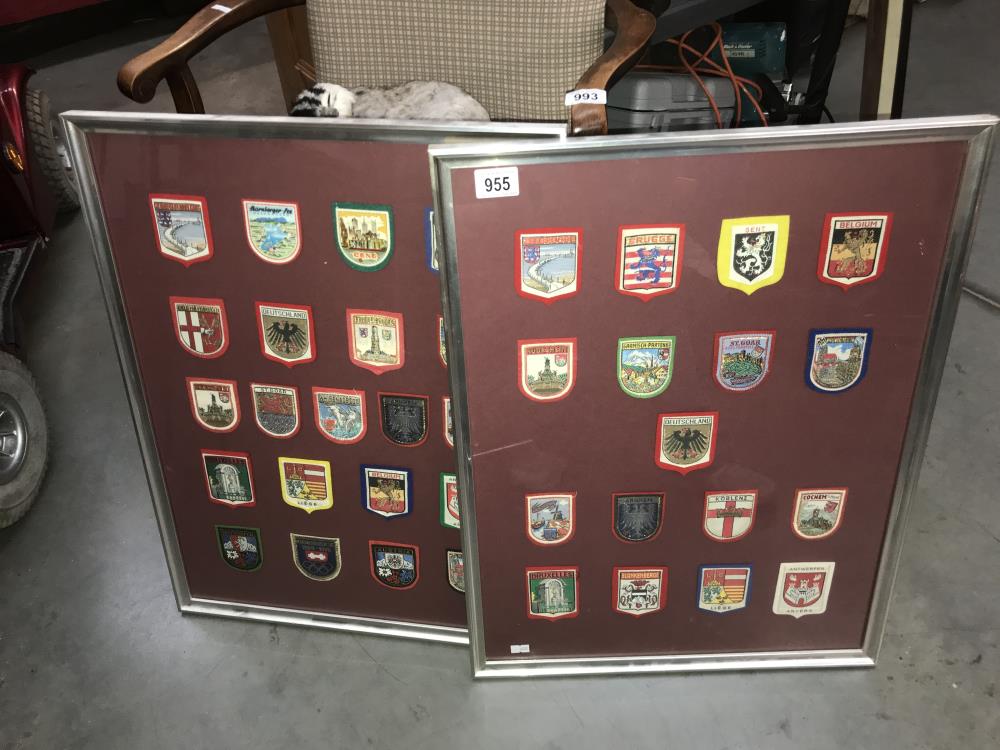 Two framed fabric shield badges