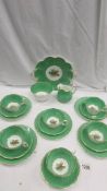 A green floral patterned china tea set (missing 1 tea plate).