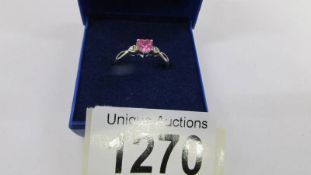 A 9ct white gold ring set with heart shaped pink stone, size N.